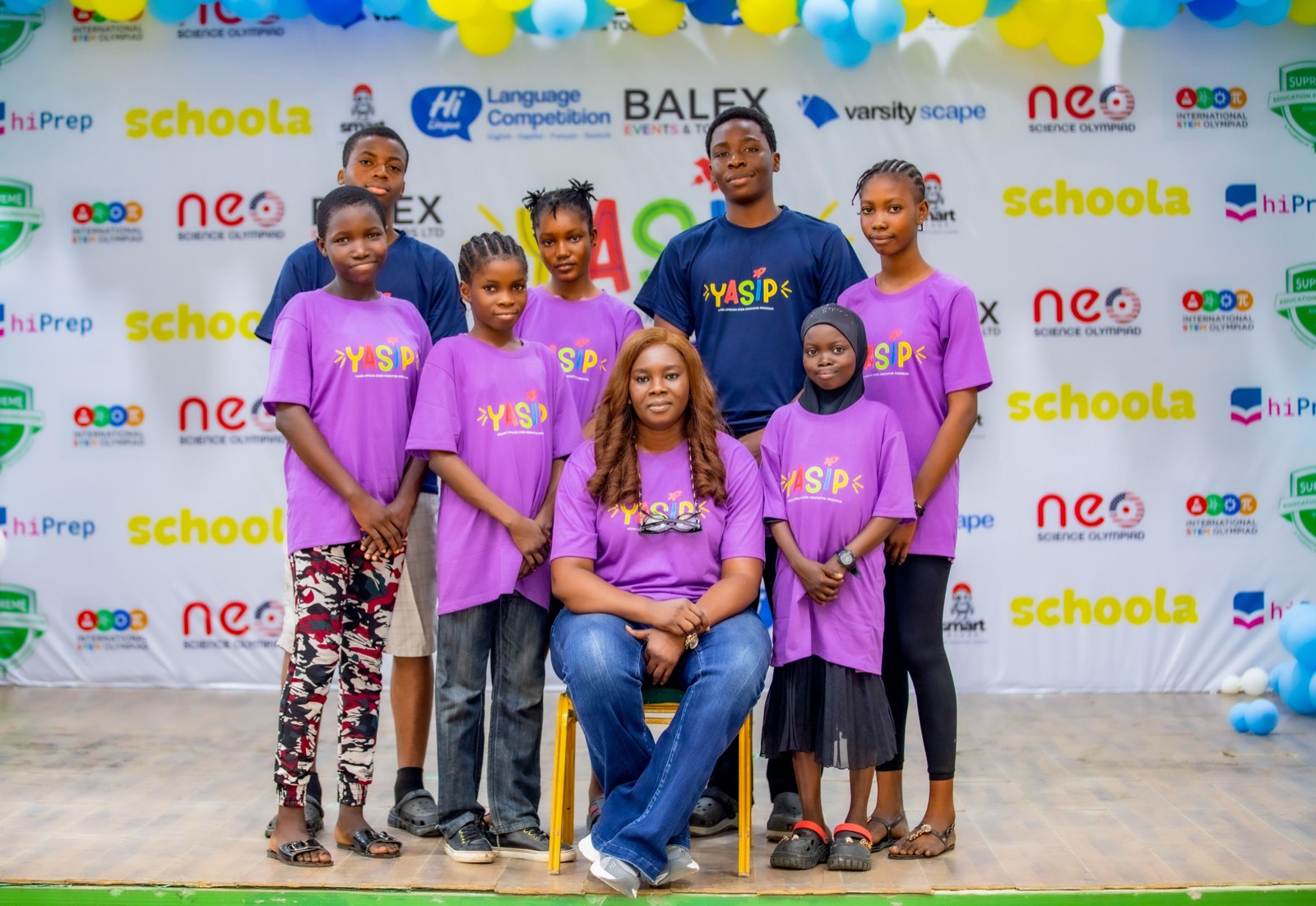 Smiling YASIP students in branded t-shirts at the bootcamp